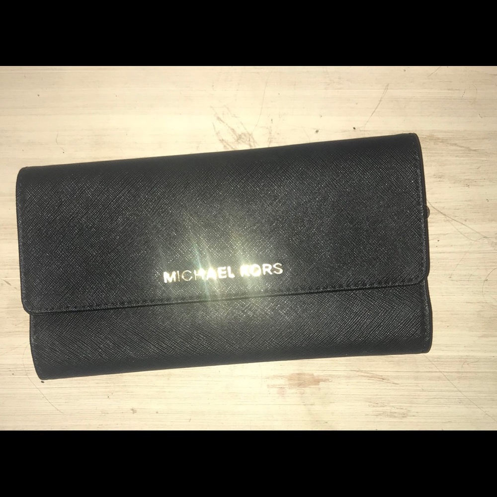Black and gold Michael Kors trifold wallet